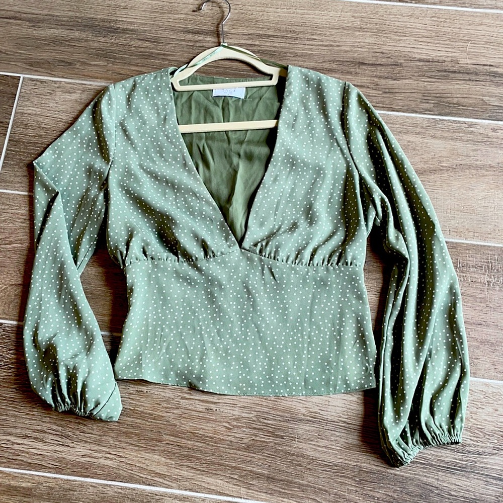 SAGE The Label cropped polka dot long sleeve blouse.